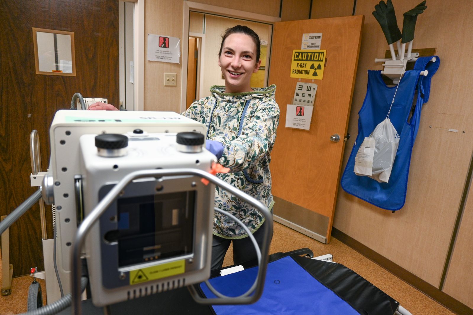 A primary health care nurse is shown using x-ray equipment in Carmacks, Yukon