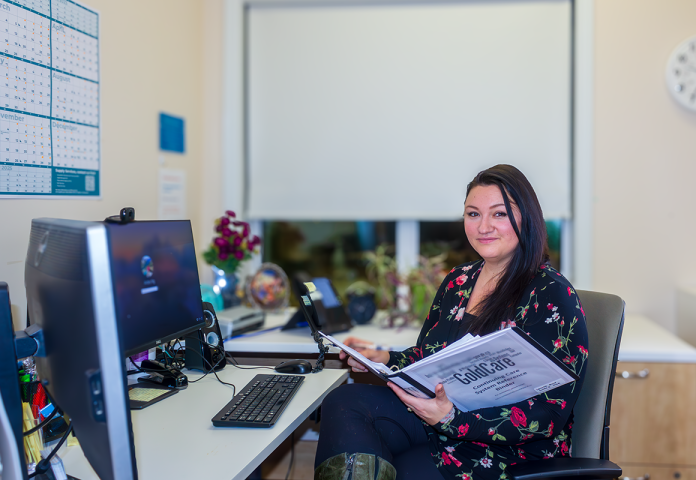 a person sitting at an office desk.