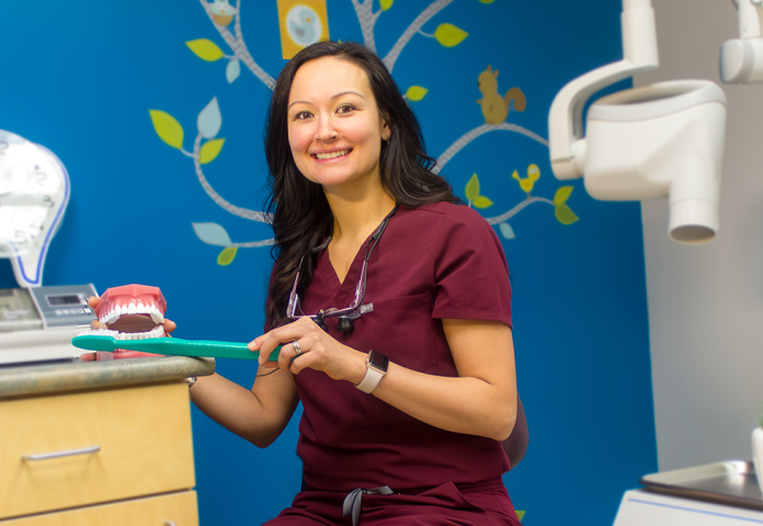 a person sitting in a dental office. 