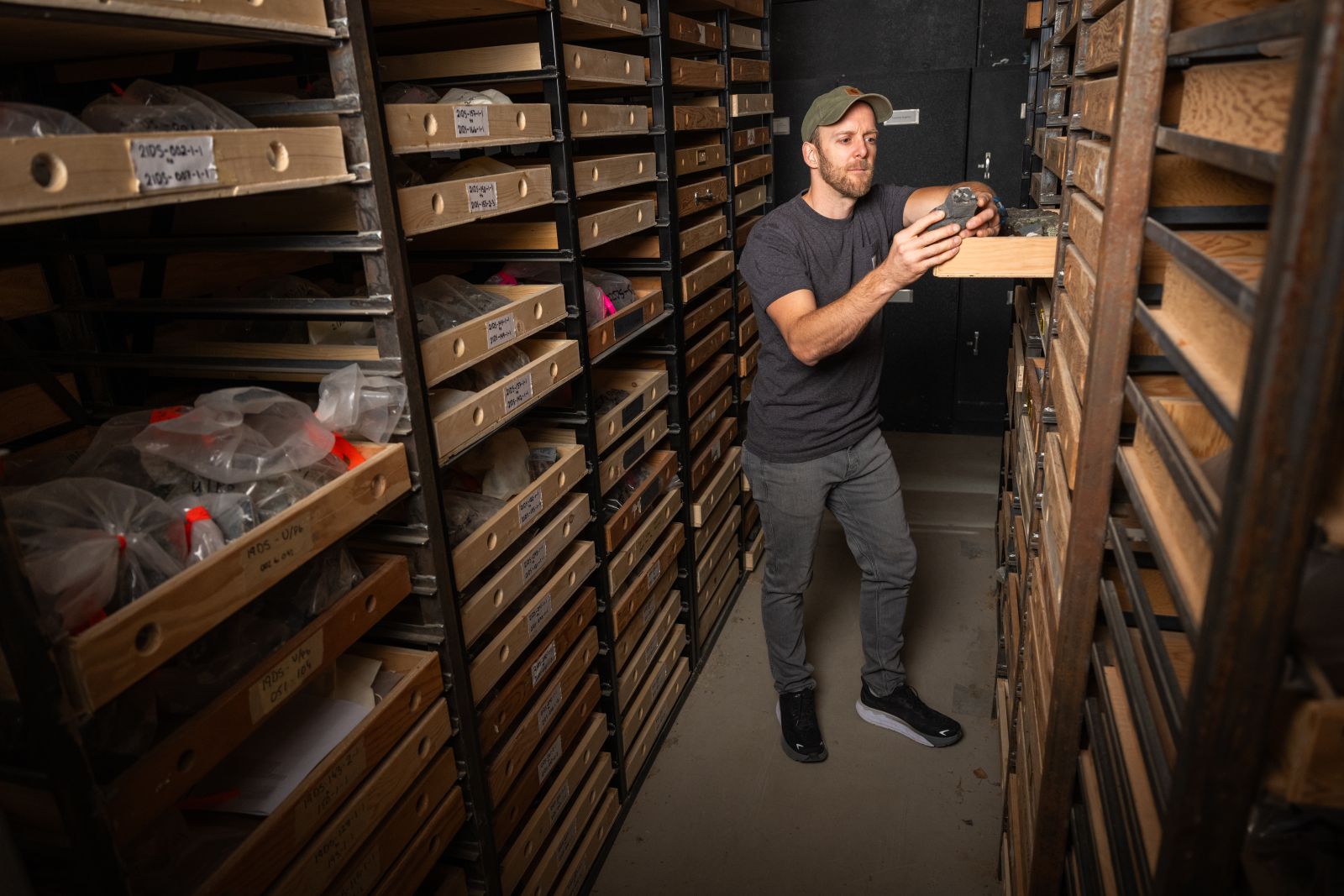 Geologist examining samples in the library.