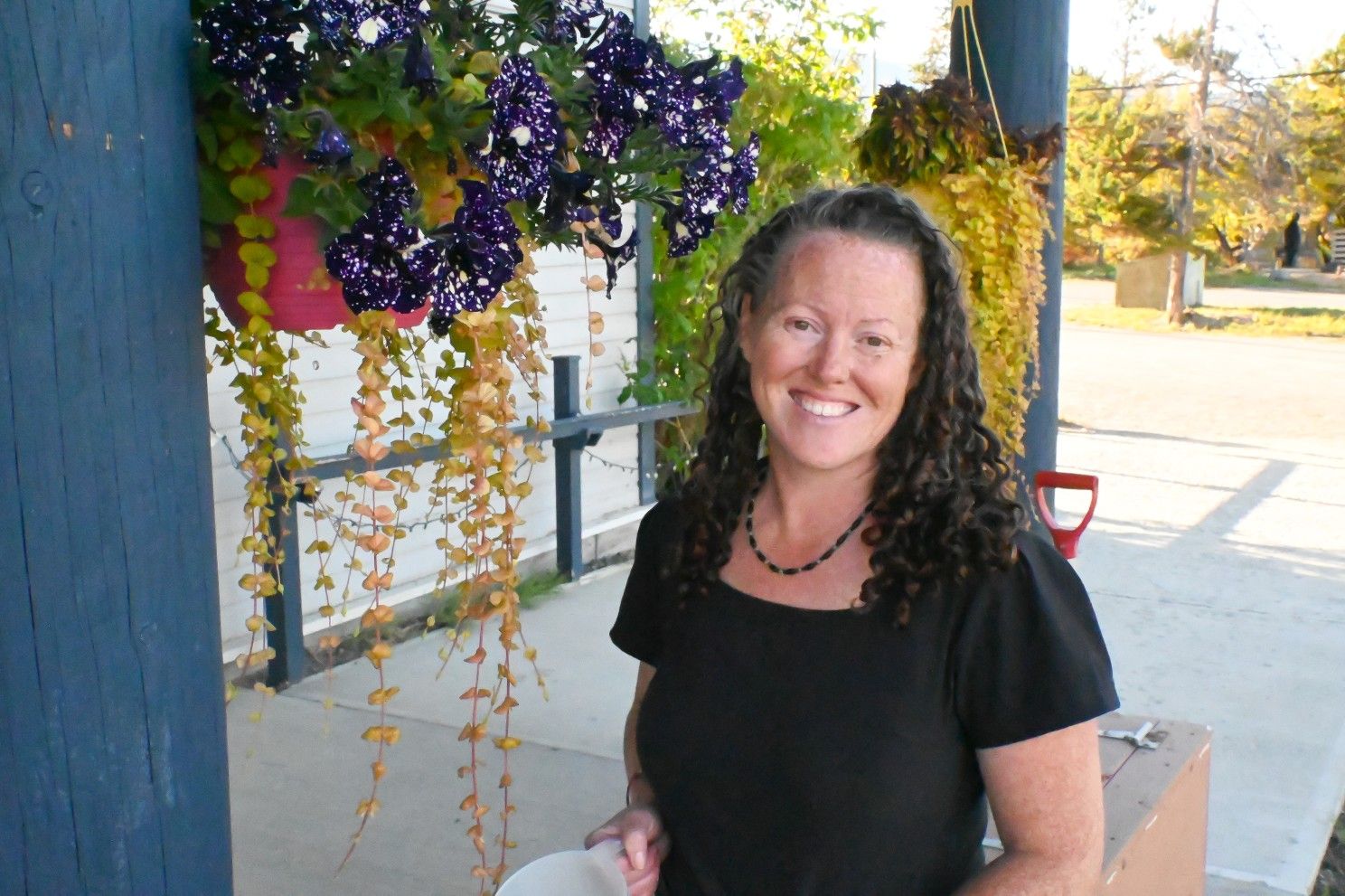 nurse posing by flowers