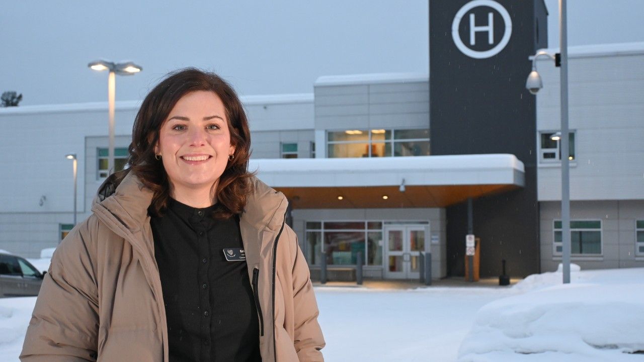 nurse standing outside a hospital