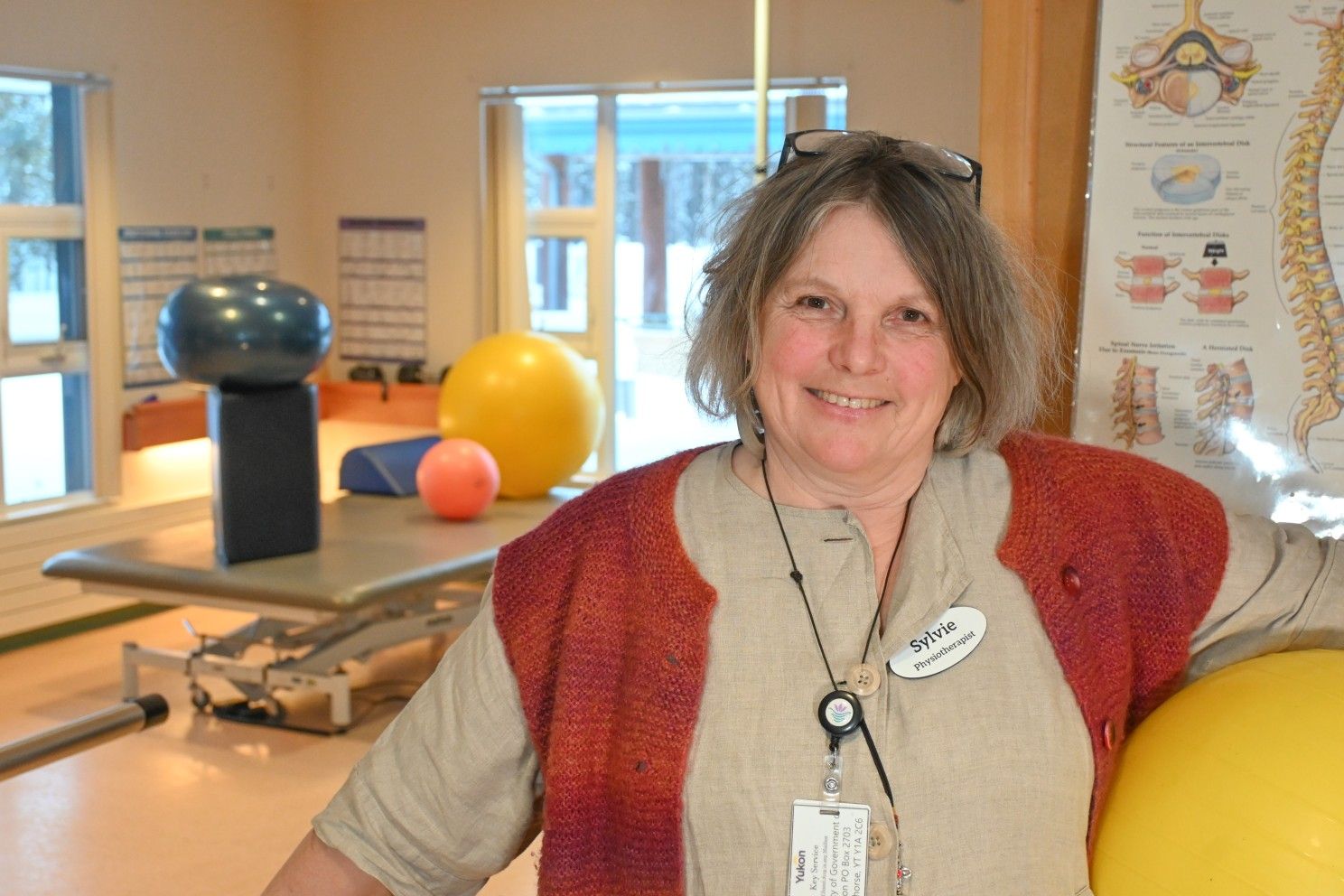 physiotherapist holding a bounce ball 