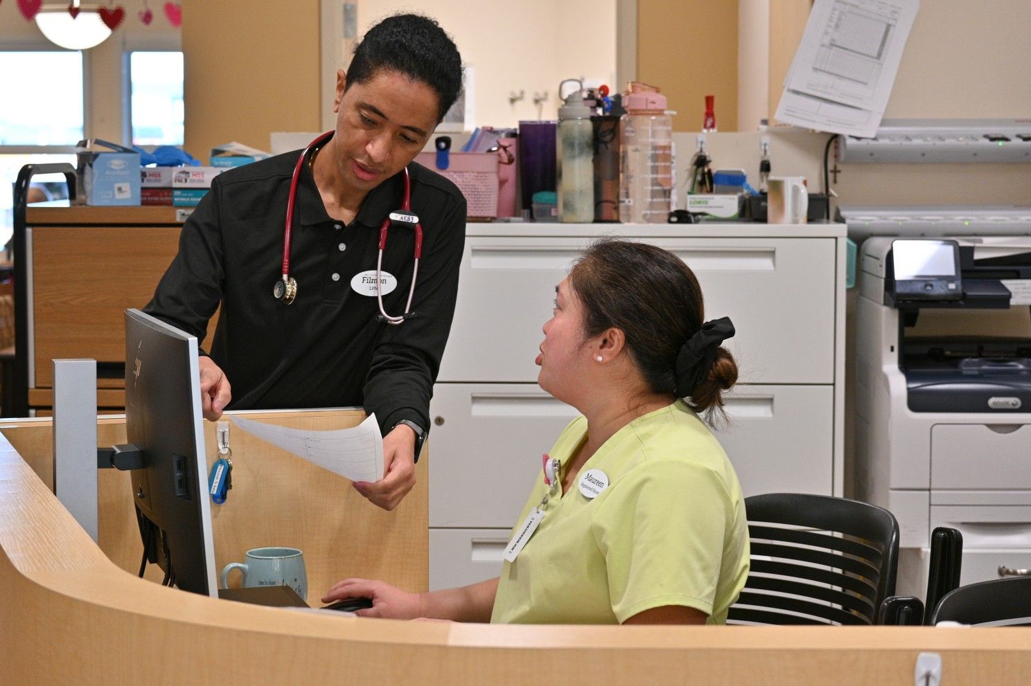 Fil talking to a receptionist