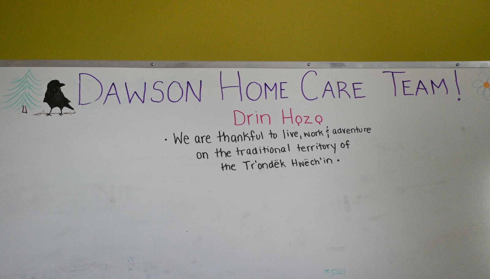 A whiteboard posts the days' assignments for the home care team in Dawson City, Yukon