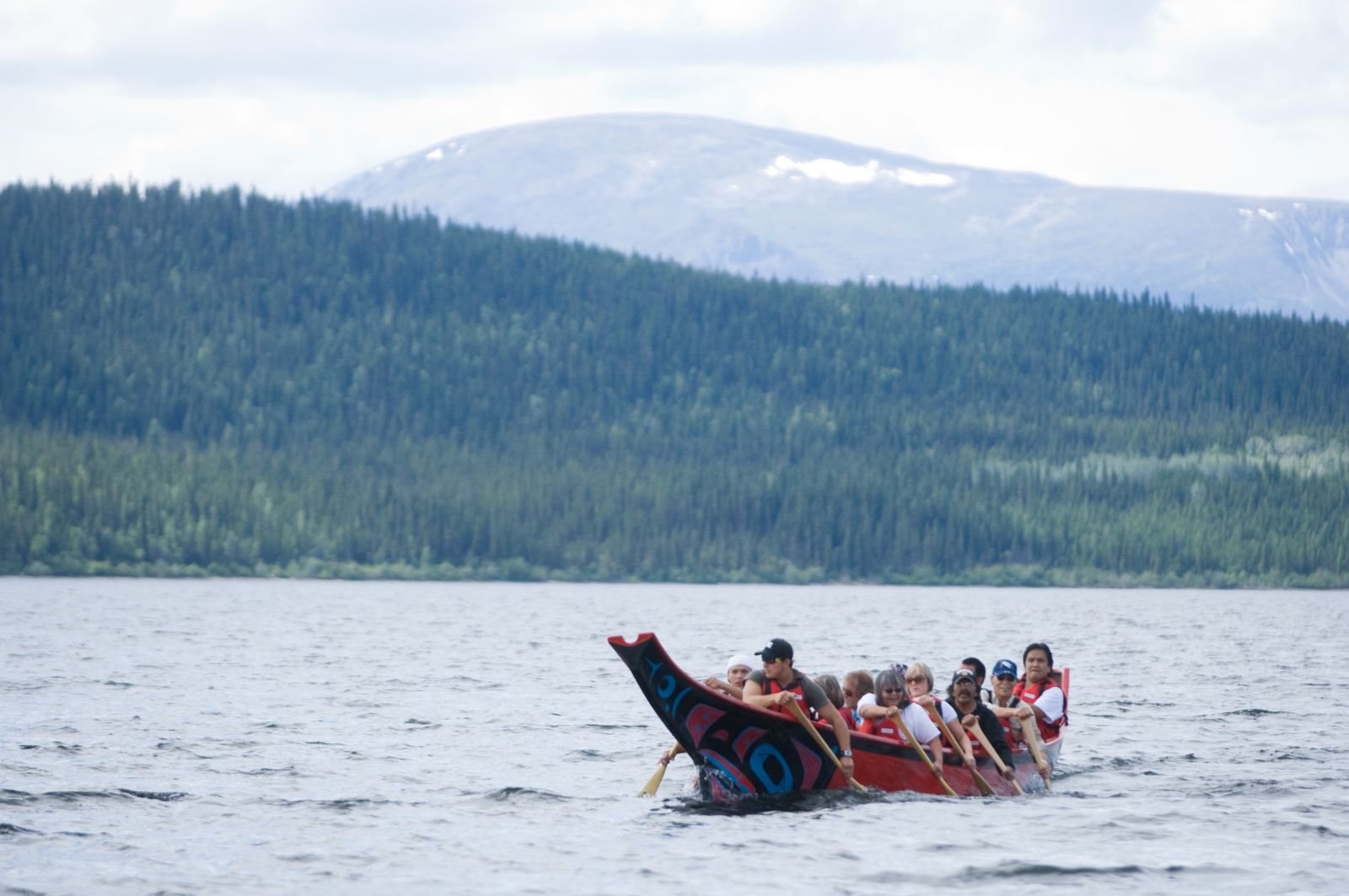 A dugout canoe is piloted during Ha Kus Teyea Teslin Tlingit Celebrations, which are a marquee Tlingit cultural event.