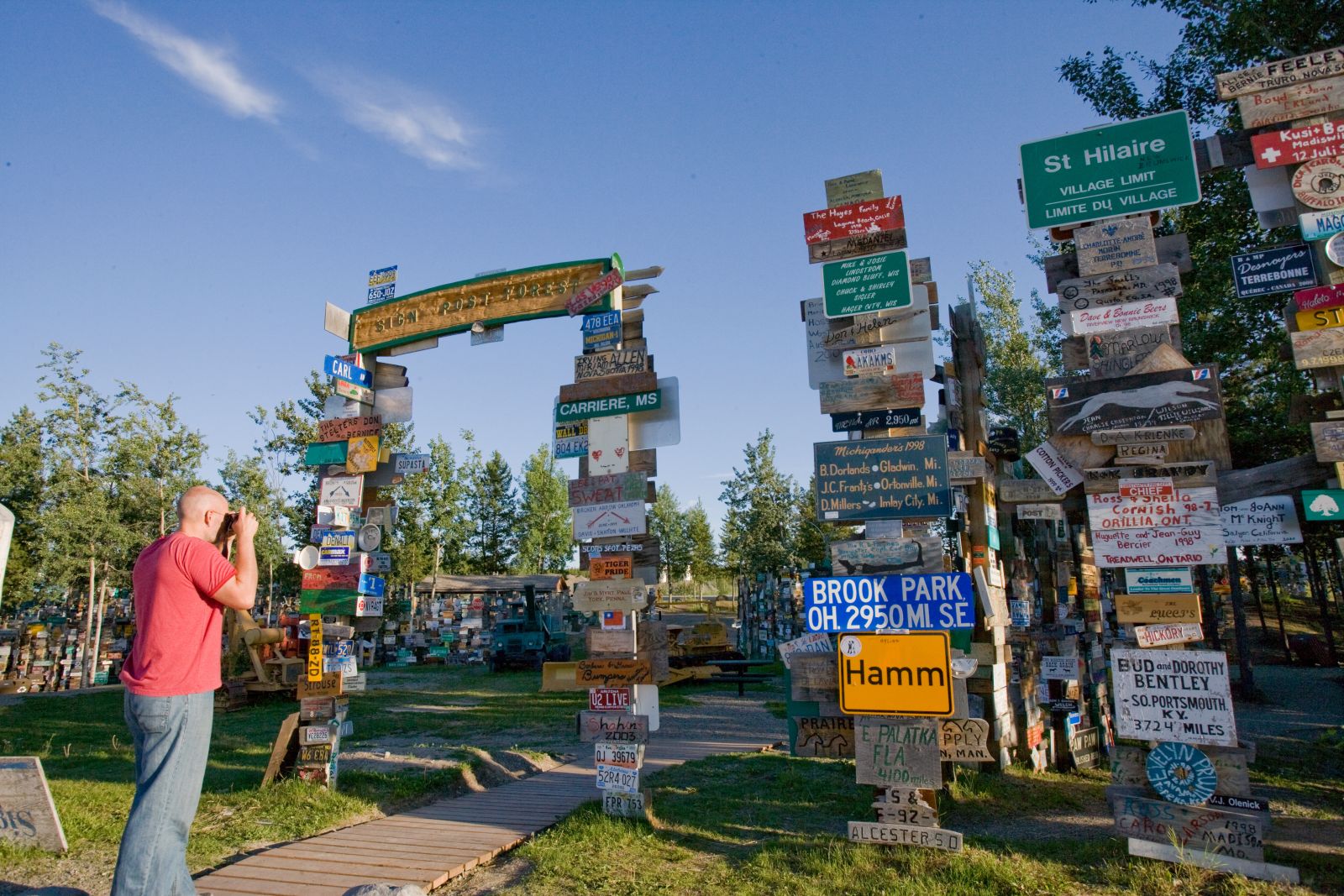 A peculiar feature in Watson Lake is the signpost forest, which collects signs from around the world.