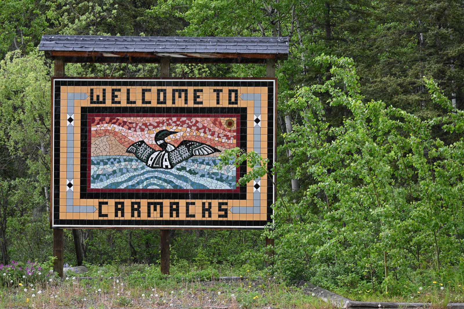 A sign welcomes visitors to Carmacks, Yukon
