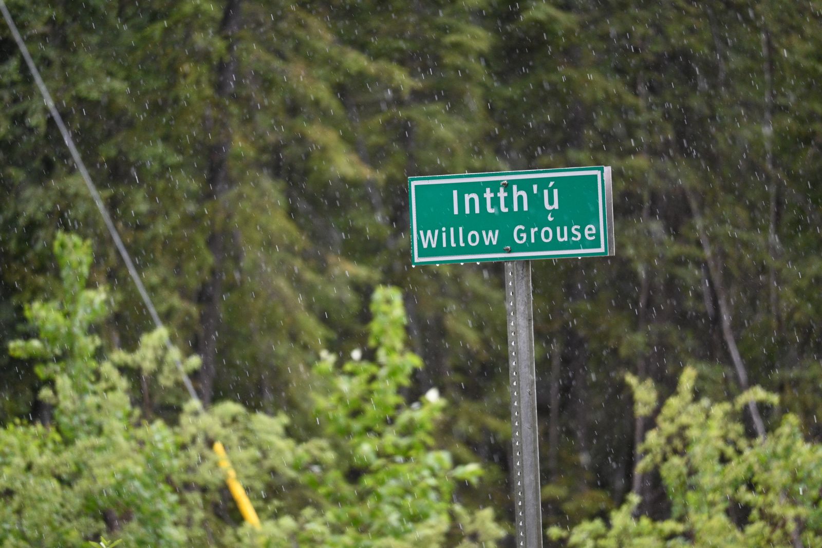 A road sign in Carmacks features the Northern Tutchone language