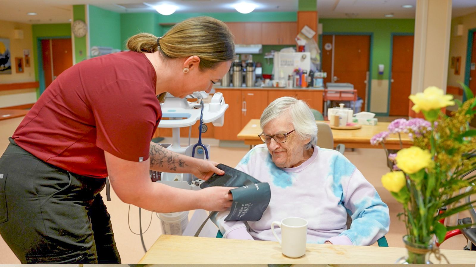 An interior of Copper Ridge Place in Whitehorse showing someone receiving a blood pressure test