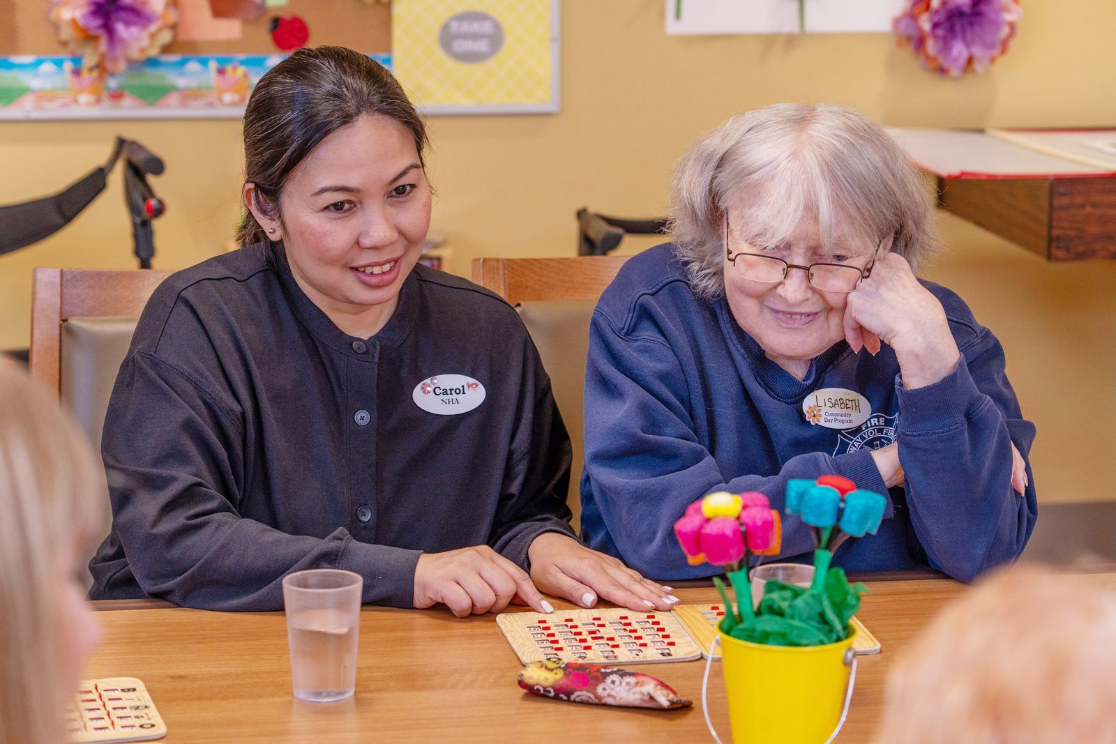 A health care assistant is shown with a client at the Seniors and Elders Community Day Program. in Whitehorse