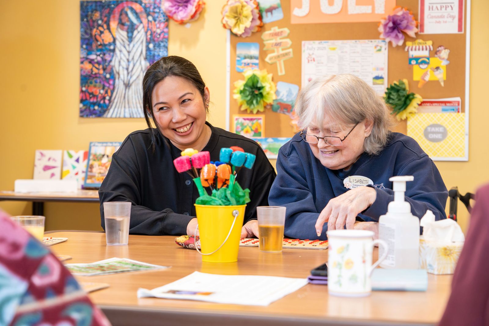 A health care assistant is shown with a client at the Seniors and Elders Community Day Program in Whitehorse