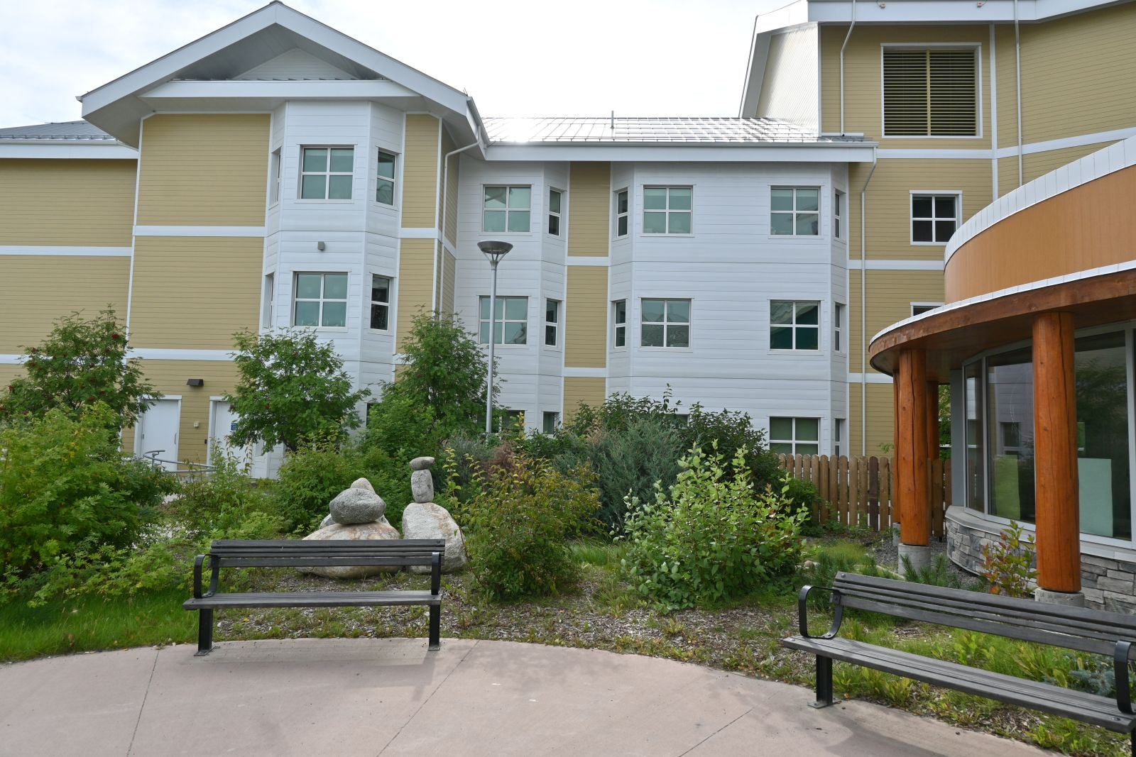 A seating area outside of Whistle Bend Place, in Whitehorse