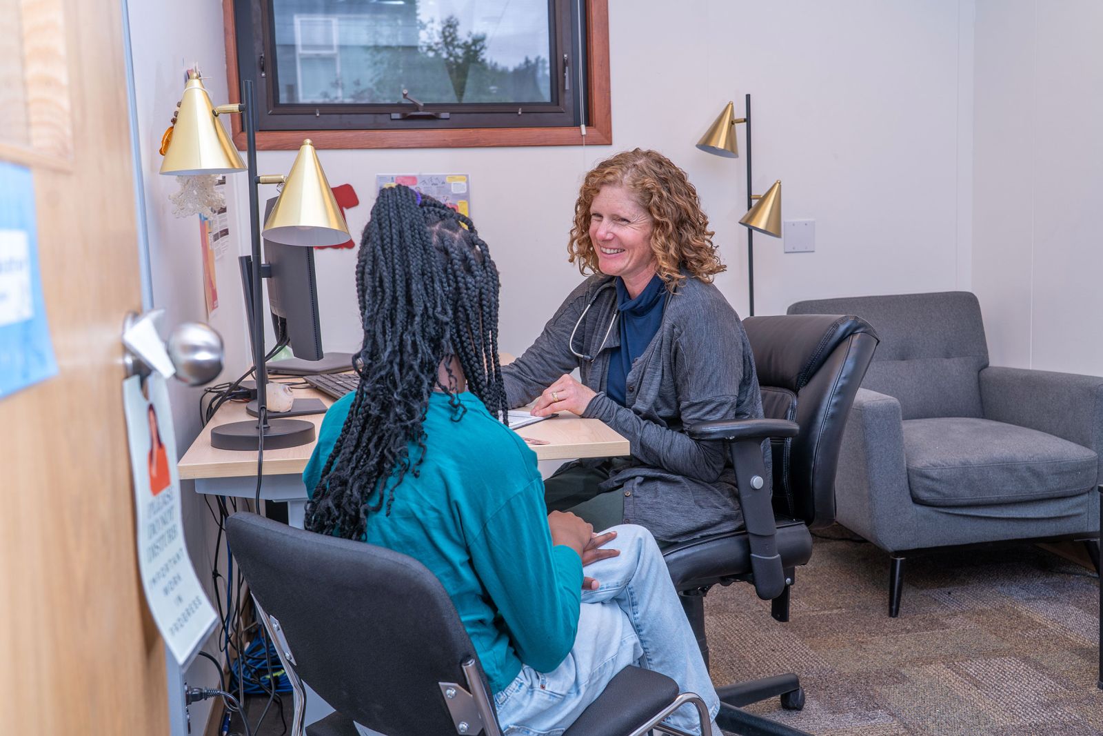 A nurse at the Youth Outreach Clinic is shown attending to a young person