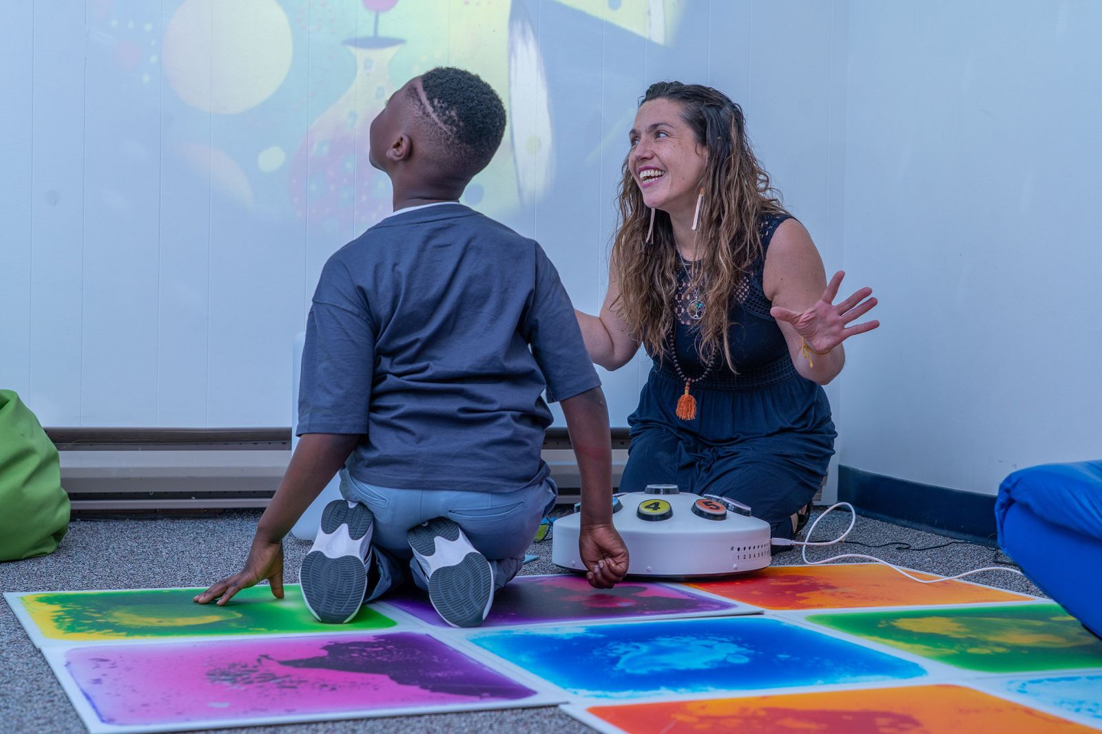 The Youth Outreach Clinic, a clinical supervisor shows a youth the "sensory room" which is used to create a interesting, low-stress environment