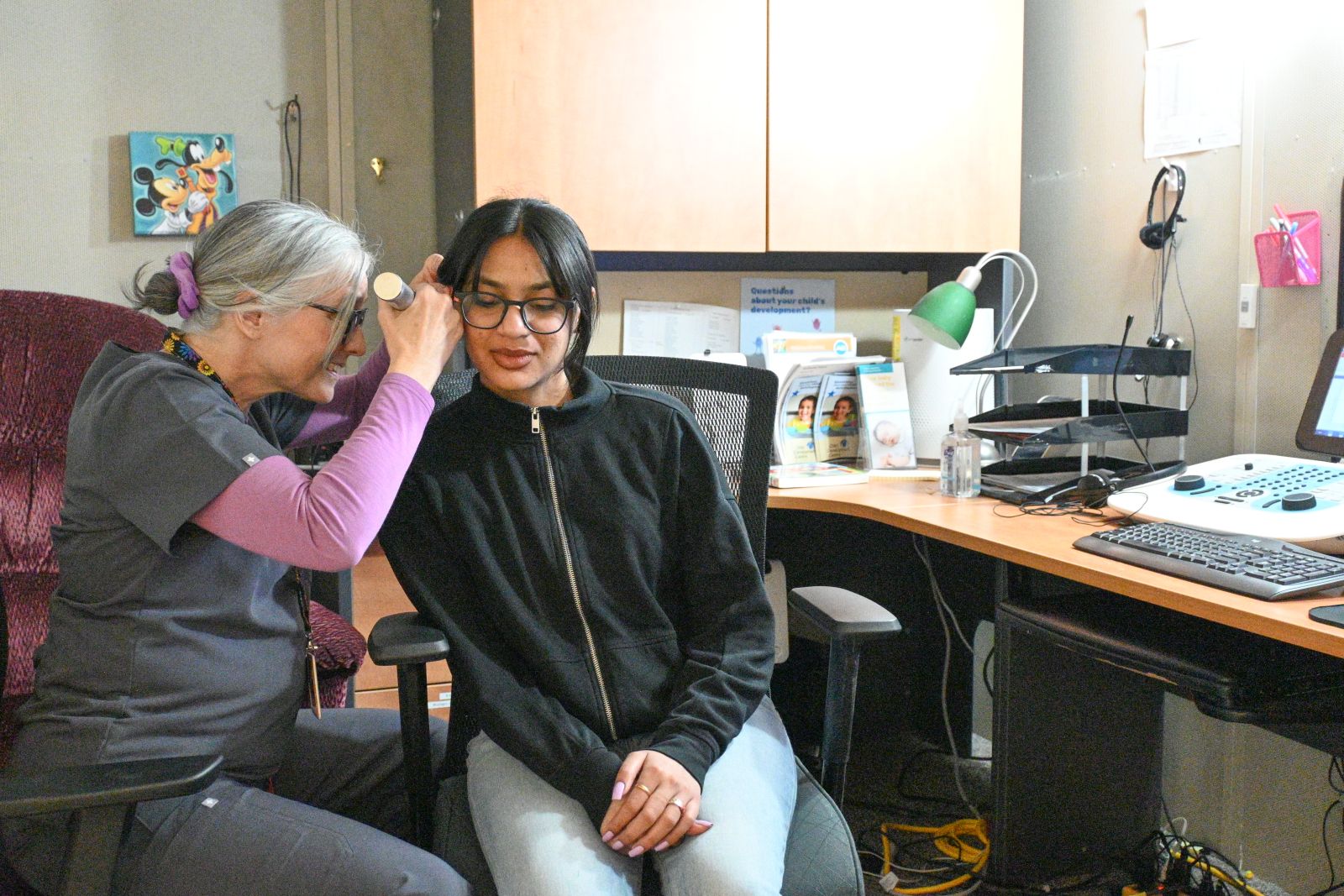 An audiologist is seen at work in Whitehorse examining someone's ear