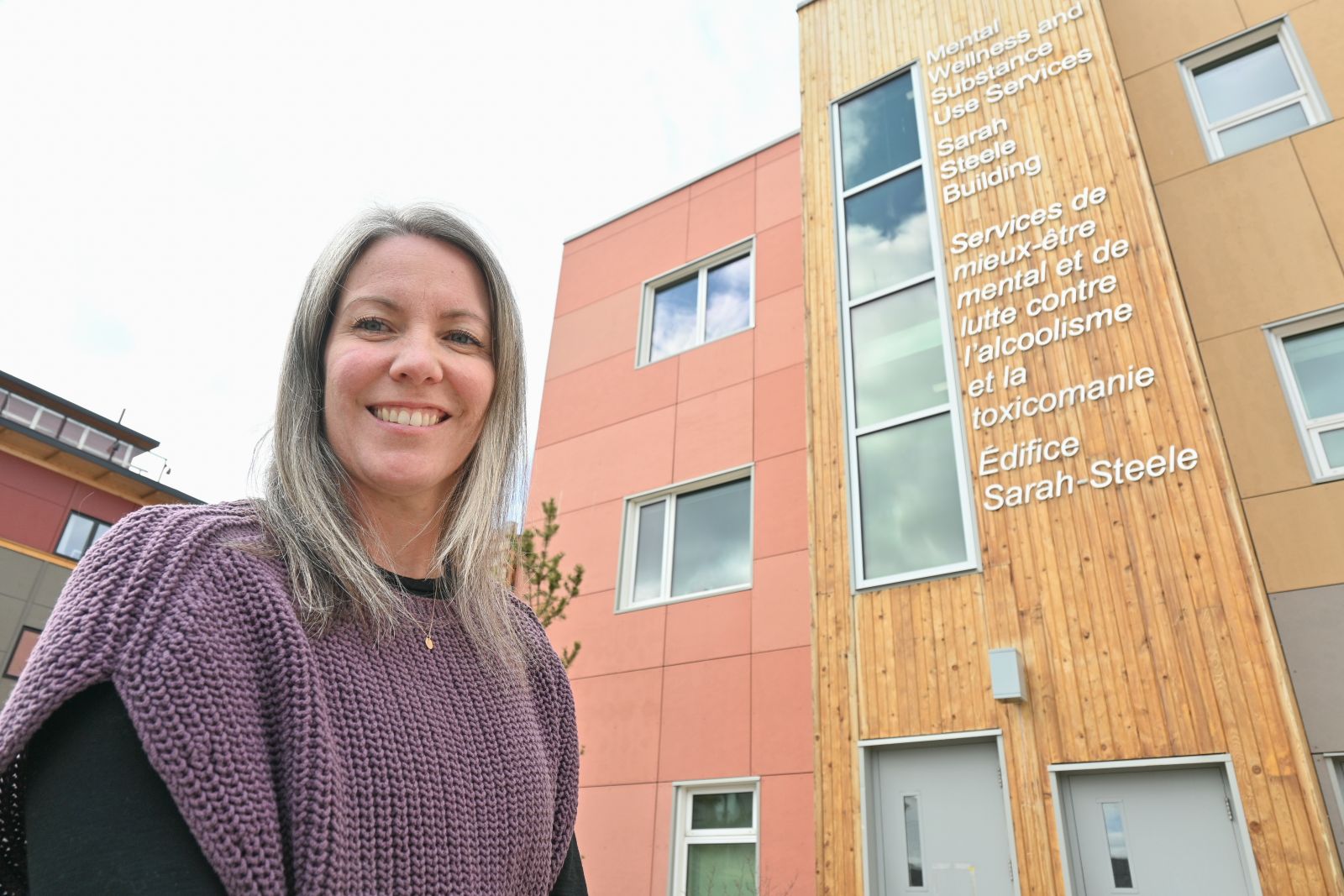 A nurse stands outside the Sarah Steele building in Whitehorse