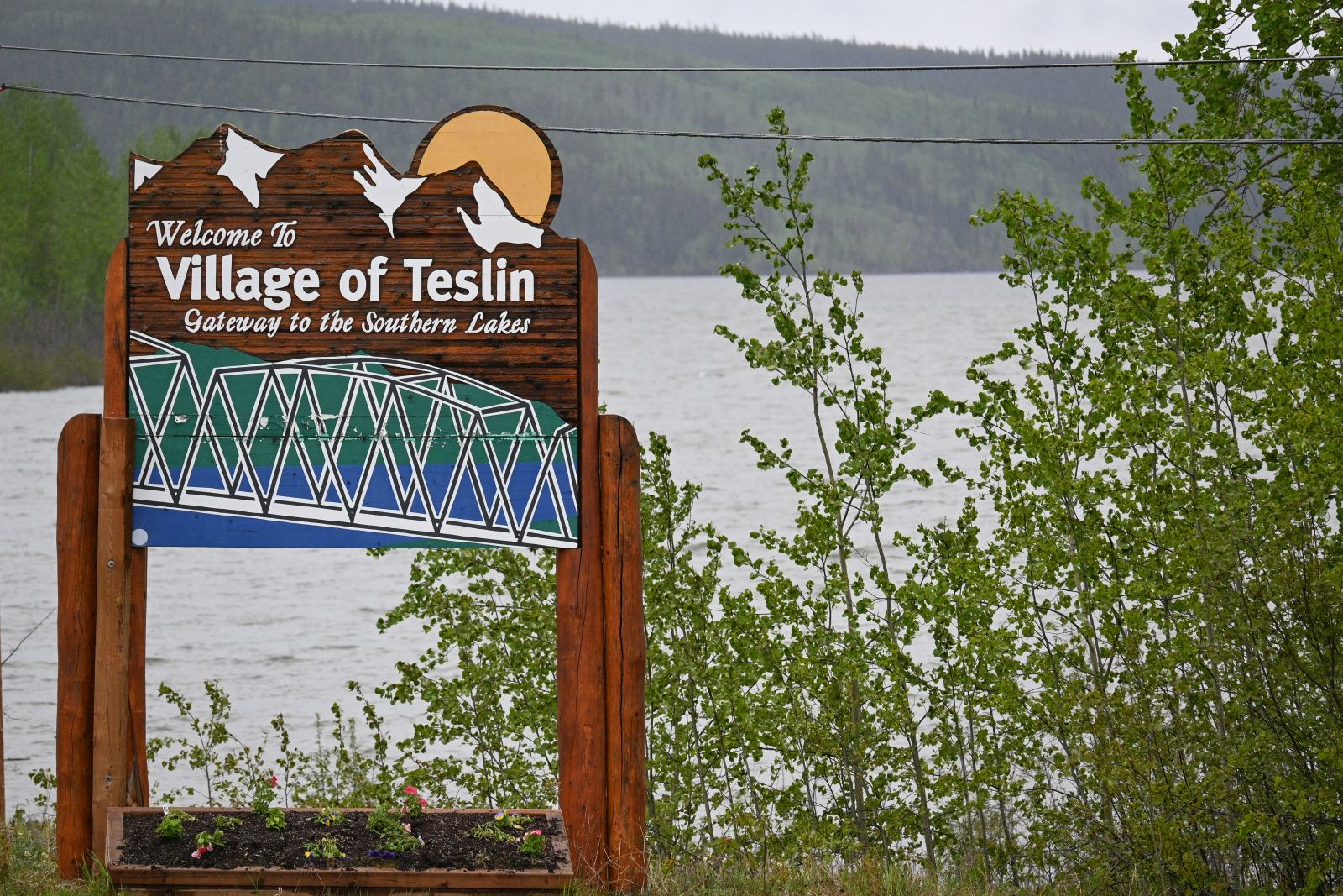 A Village of Teslin sign welcomes travellers on the Alaska Highway