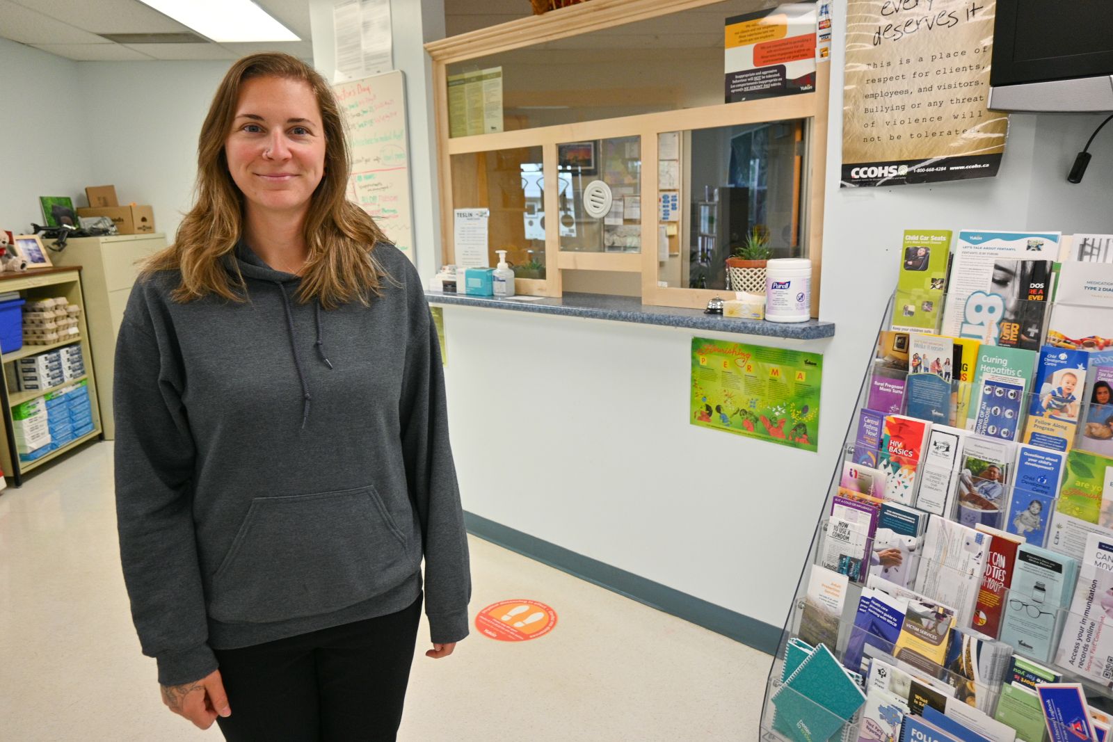 An administrative assistant is shown at the community health centre in Teslin