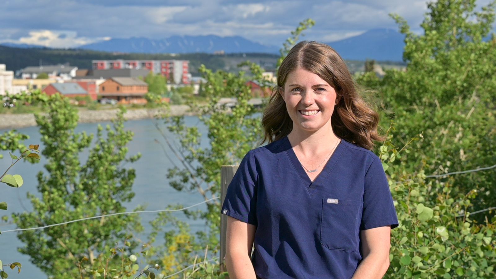 Dr. Aline Halliday is seen on a bluff overlooking Whitehorse, Yukon