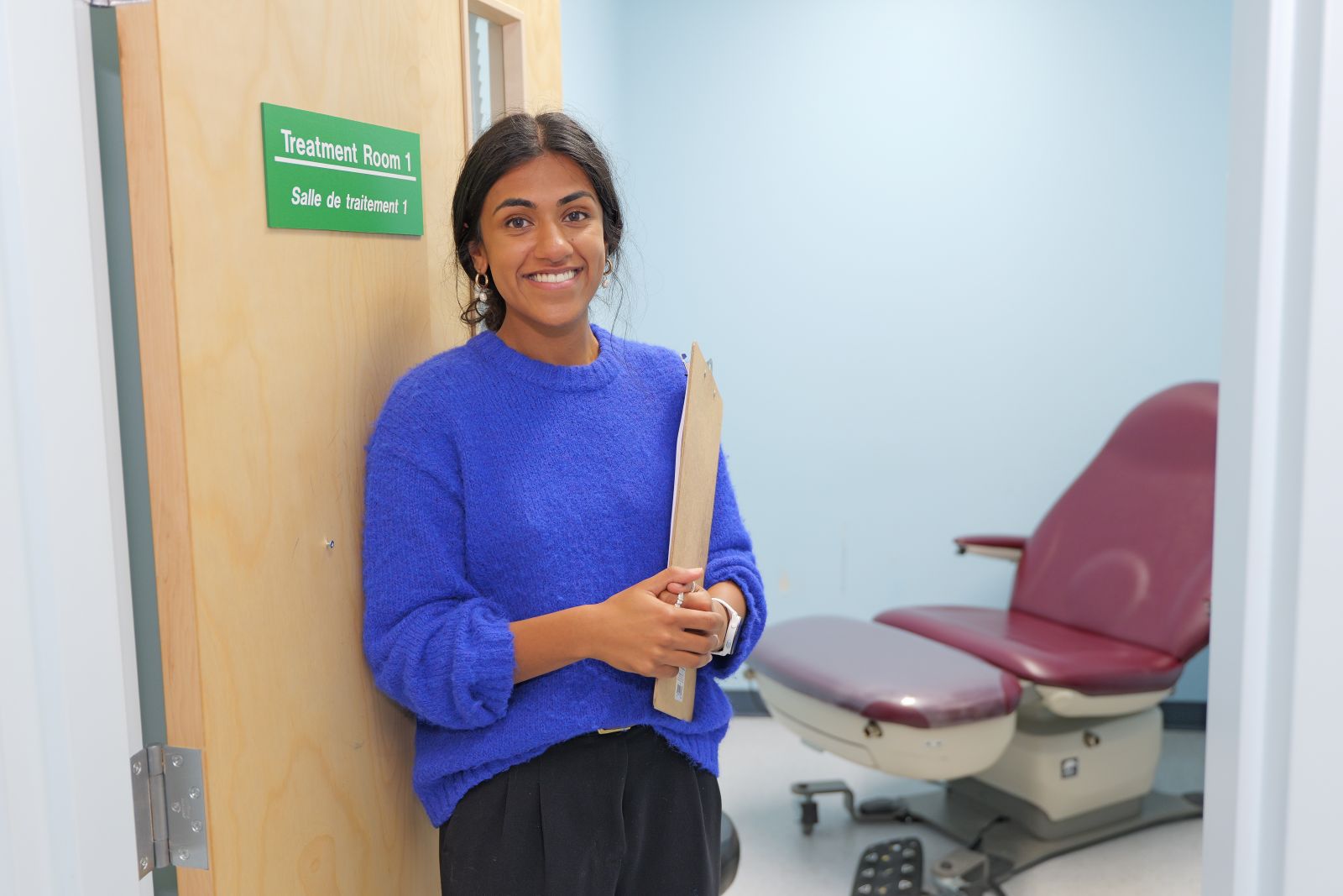 A registered nurse stands in the Yukon at her workplace