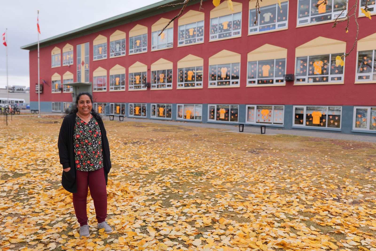 A dental hygienist stands outside Whitehorse Elementary School where the Yukon Children's Dental Program has a room to provide dental care. 