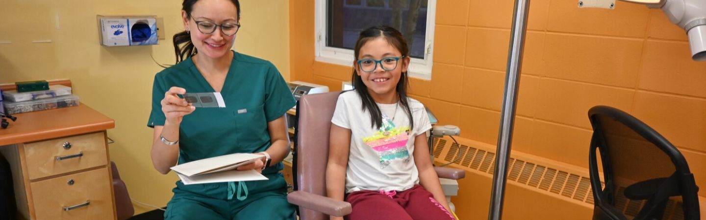 dental therapist with a child