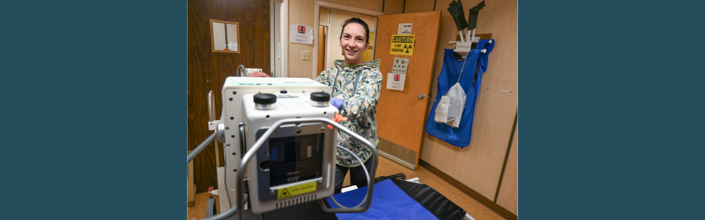 A primary health care nurse is shown using x-ray equipment in Carmacks, Yukon