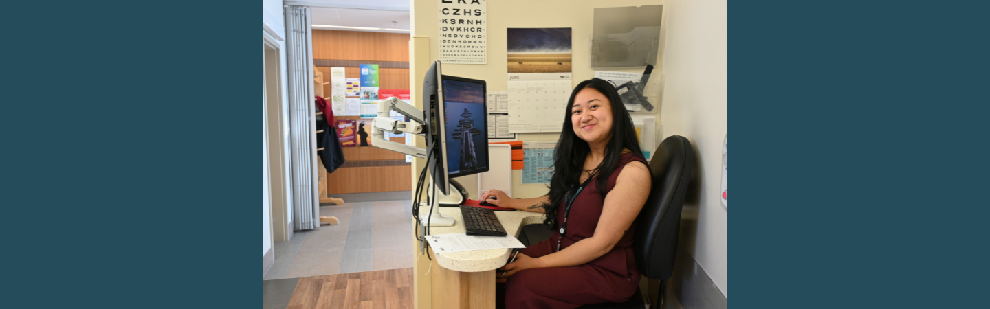 A medical office assistant is shown at work in Dawson City