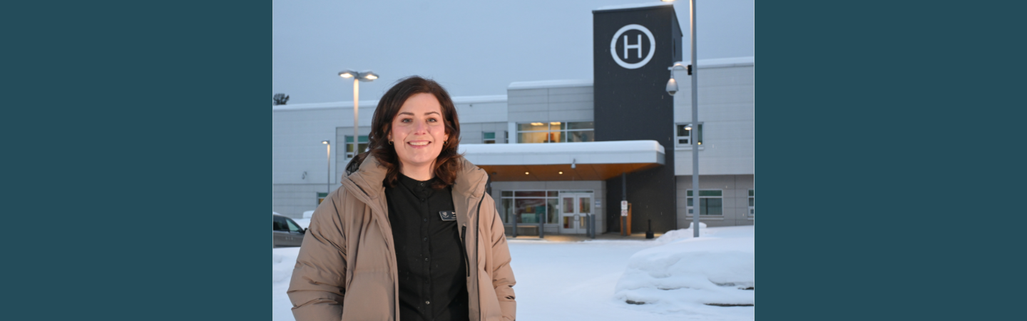 A nurse stands outside of Watson Lake Community Hospital