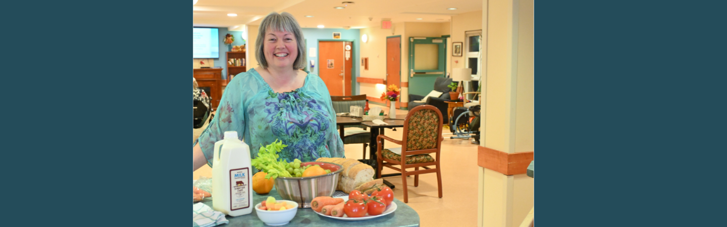 A dietitian is shown at work at Copper Ridge Place in Whitehorse surrounded by fresh foods