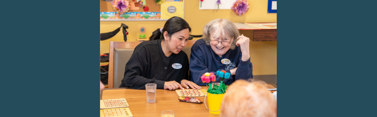 A health care assistant is shown with a client at the Seniors and Elders Community Day Program. in Whitehorse