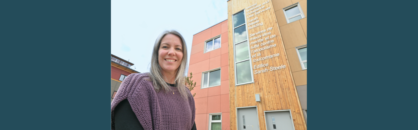 A psychiatric nurse stands at her workplace in Whitehorse