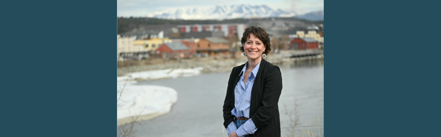 A nurse practitioner is shown in Whitehorse by the Yukon River