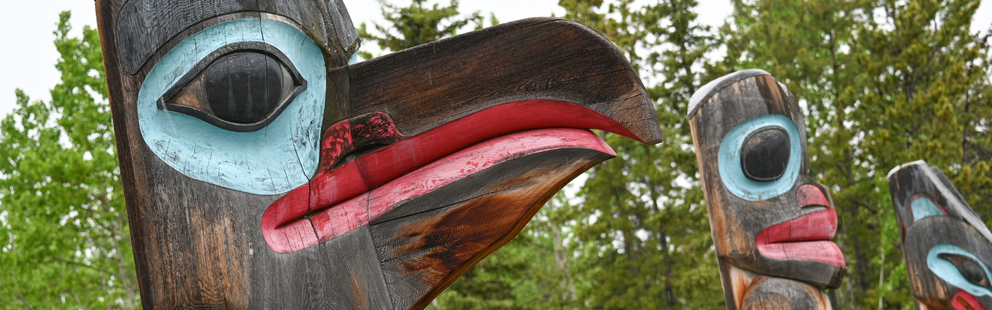 Totems outside the Teslin Tlingit Heritage Centre in Teslin
